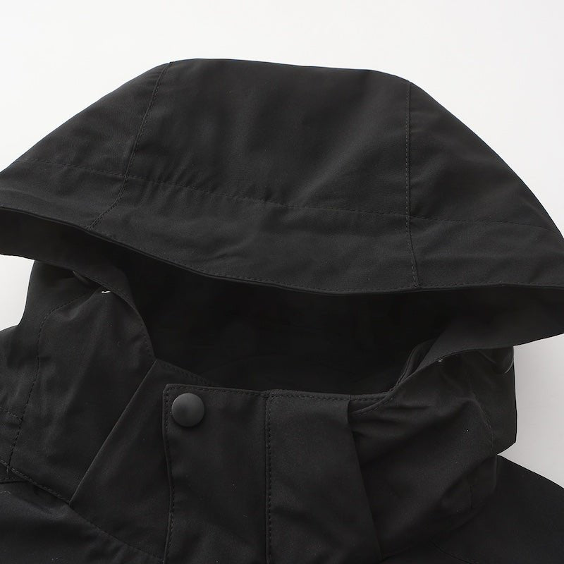 Trekker jacket fabric close-up showing weatherproof shell and cut-proof sleeves