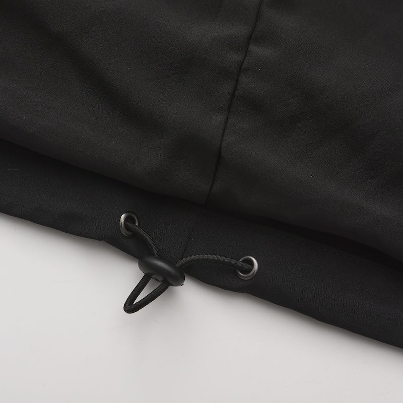 Side view of Trekker coat showing full-length protective coverage