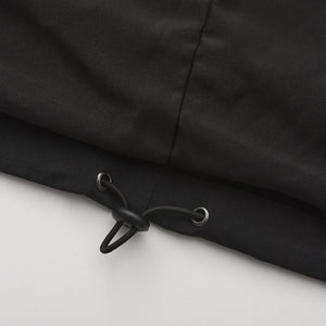 Side view of Trekker coat showing full-length protective coverage