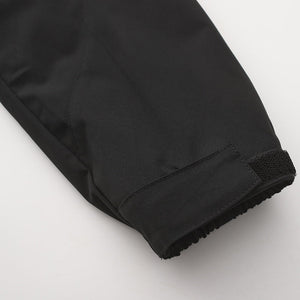 Trekker coat pocket design with secure weatherproof closure detail